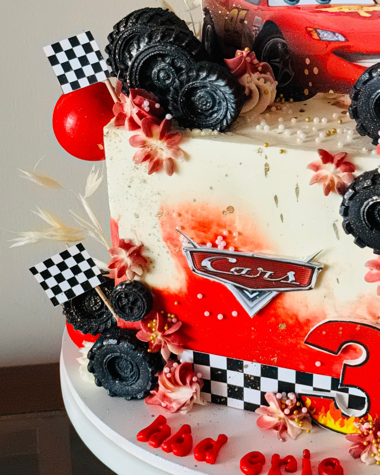 Cars themed birthday cake with red racing details